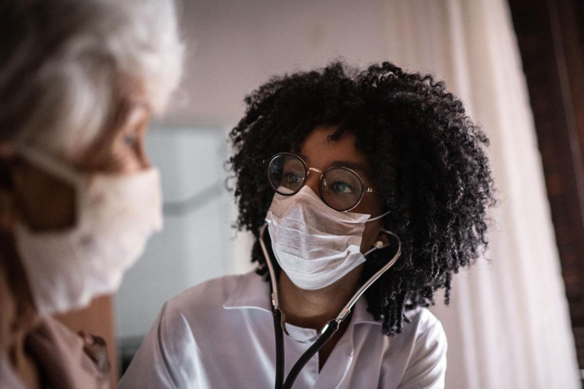 Physician and patient in face masks