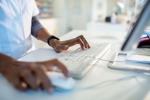 Person looking up information on the computer