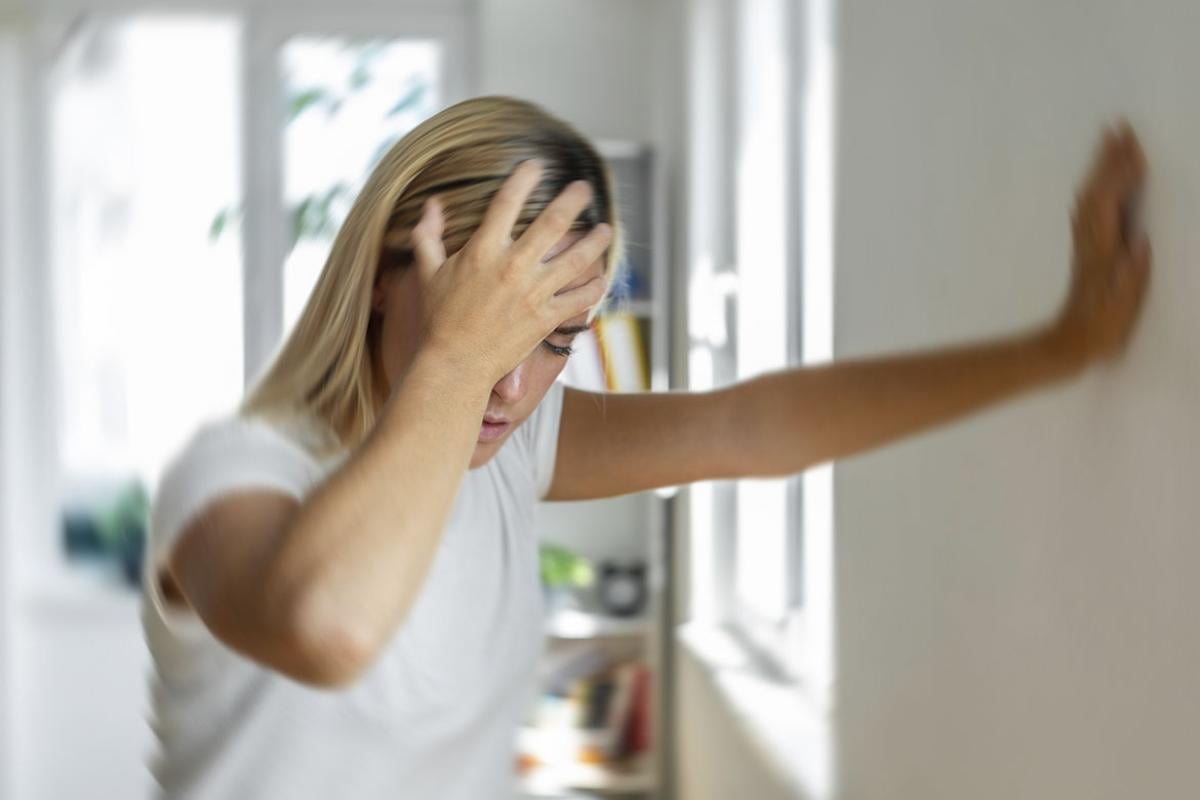 Woman experiencing vertigo